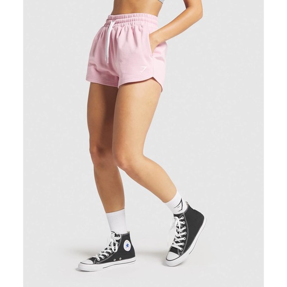 Gymshark Pants - New Gymshark Throw on Shorts shell pink size M